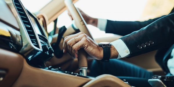 Changing all the right gears. Cropped shot of an unrecognizable man driving